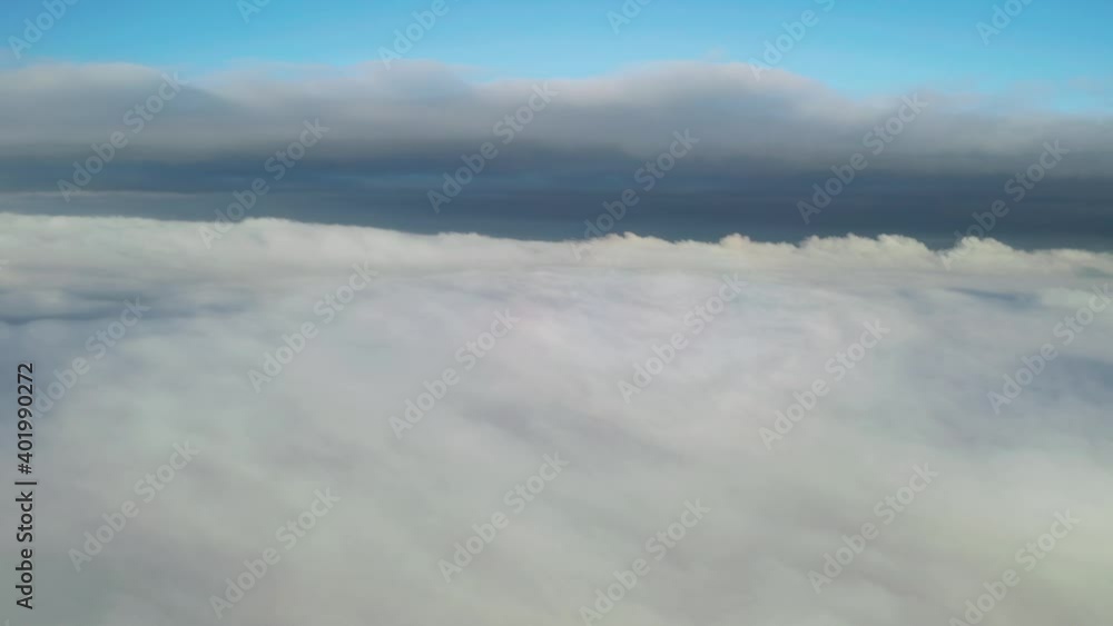 Foggy morning in summer mountains from above. Aerial top view drone flies through heavenly fluffy rain clouds. UHD 4k video Foggy morning in summer mountains from above. Aerial top view drone flies through heavenly fluffy rain clouds. UHD 4k video