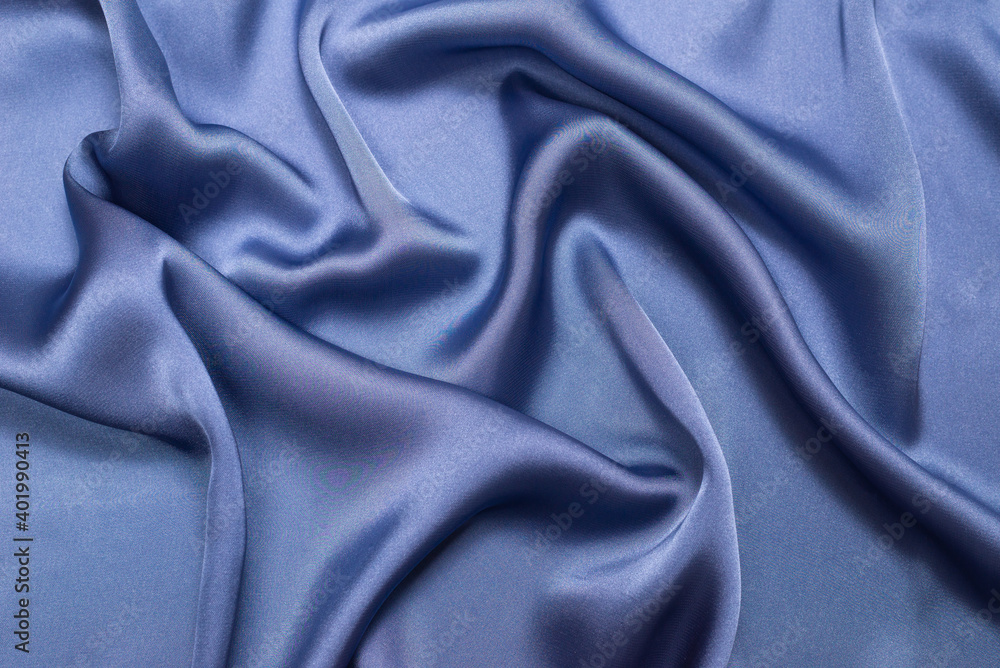 Blue silk or satin luxury fabric texture. Top view. Blue silk or satin luxury fabric texture. Top view.