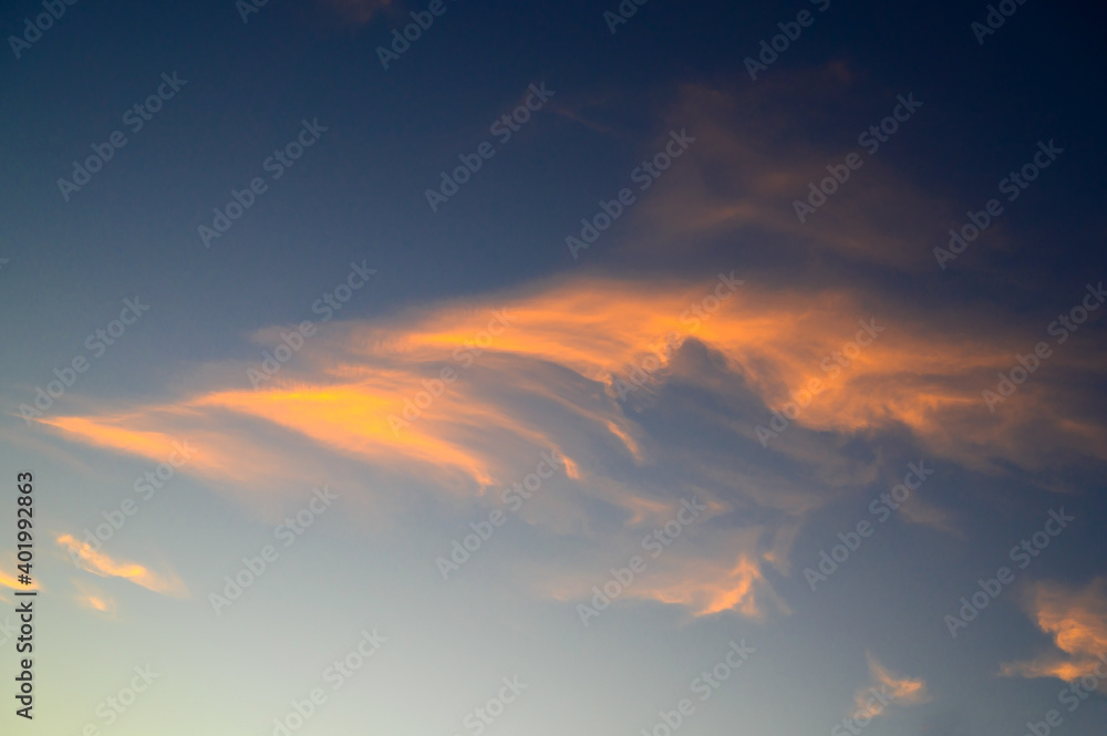 Dramatic sky at sunset with blue sky yellow and orange cloud colors. Dramatic sky at sunset with blue sky yellow and orange cloud colors.