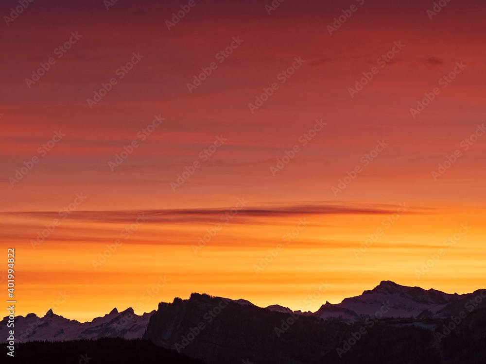 Burning sky over the Swiss Alps before sunrise 