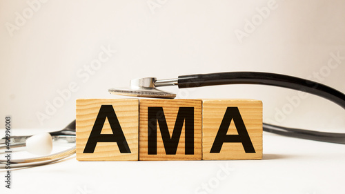 wooden cubes with text AMA . the medicine. medical concept