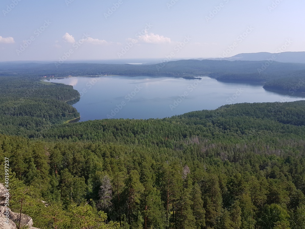 Blue lake among the green Siberian taiga