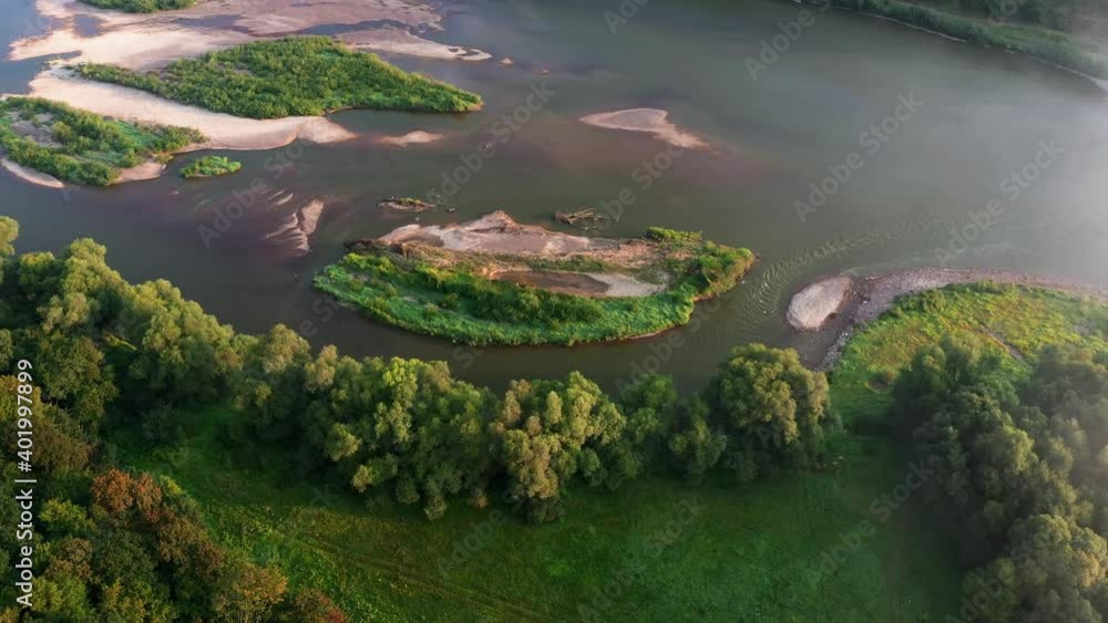 Flight through majestic foggy river Dnestr and lush green island with forest at sunrise time. Dniester canyon, Ukraine, Europe. Aerial UHD 4k drone video Flight through majestic foggy river Dnestr and lush green island with forest at sunrise time. Dniester canyon, Ukraine, Europe. Aerial UHD 4k drone video