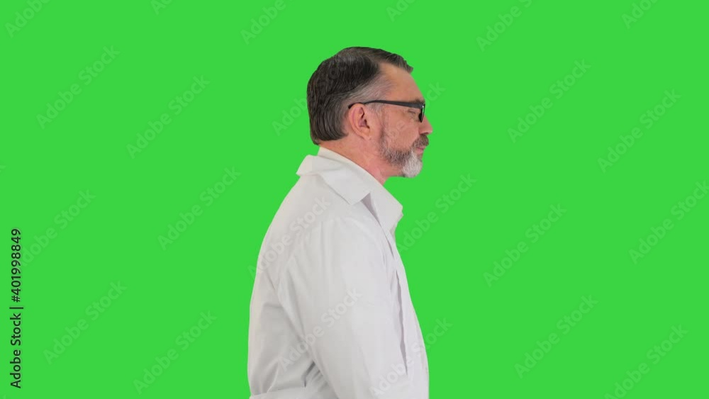 Mature doctor physician walking isolated on a Green Screen, Chroma Key. Mature doctor physician walking isolated on a Green Screen, Chroma Key.