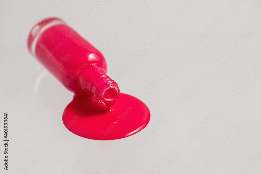 An inverted bottle of spilled nail polish. An inverted bottle of spilled nail polish.