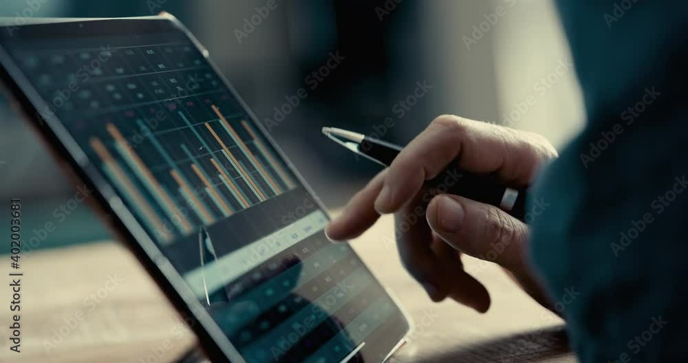 Reviewing business report on digital tablet
