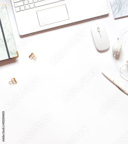Business concept frame with a laptop on the white background. Top view. Copy space