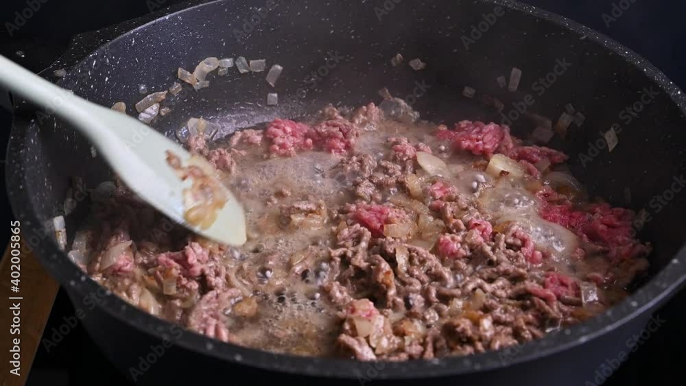Traditional meat sauce for pasta, spaghetti and lasagna in Bologna. Stew bolognese with meat and spices. Cooking in northern italy. High quality 4k footage Traditional meat sauce for pasta, spaghetti and lasagna in Bologna. Stew bolognese with meat and spices. Cooking in northern italy. High quality 4k footage