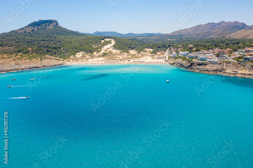 An aerial panorama of Cala Mesquida shoreline on Mallorca island in Spain © Aliaksandr