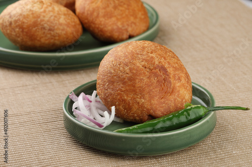 Indian teatime snack called Kachori or kachodi served with mint and tamarind dip or chutney. This is a popular in North and Central India photo