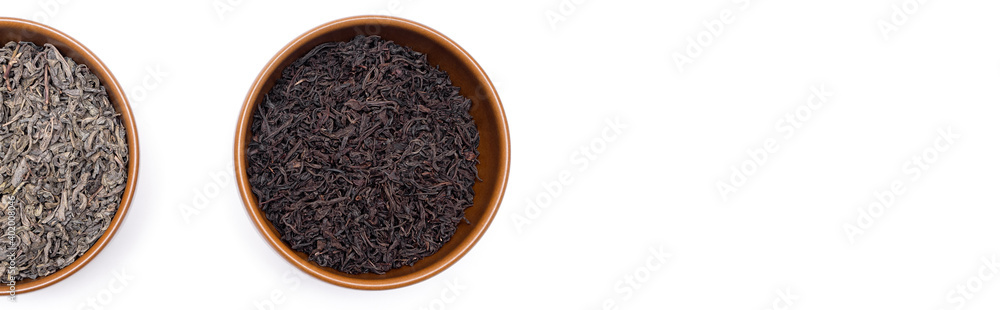Green and black tea leaves in brown plates , Japanese tea , Sencha, Ryokucha. Place for text. Copy space. Banner Green and black tea leaves in brown plates , Japanese tea , Sencha, Ryokucha. Place for text. Copy space. Banner
