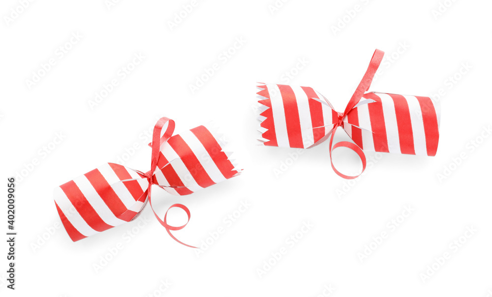 Open striped Christmas cracker isolated on white, top view Open striped Christmas cracker isolated on white, top view