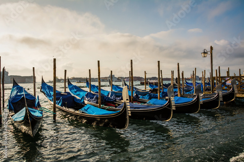 Gondolas moored outside St. Mark’s Square in Venice Italy © Lukas