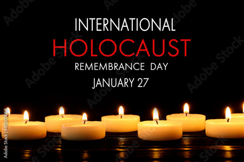 International Holocaust Remembrance Day January 27. Burning candles on black background