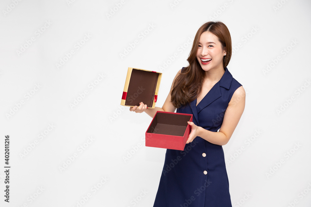 Happy beautiful Asian woman smiling and open gold gift box isolated on white background Happy beautiful Asian woman smiling and open gold gift box isolated on white background