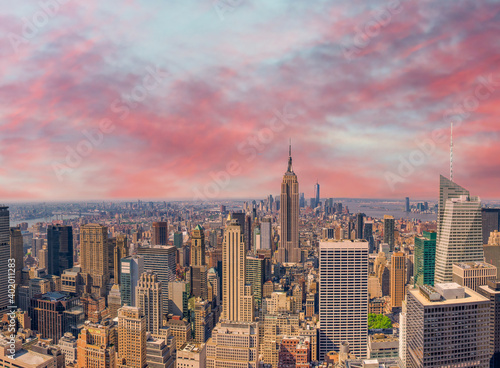 Midtown Manhattan at sunset, New York City. Panoramic aerial view of city skyscrapers at dusk