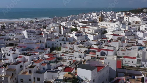 Panoramic roundlook of Conil de la Frontera and the Atlantic ocean seen from above aerial bird view