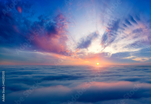 Dawn or sunset over the clouds  blue hour  aerial view.