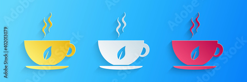 Paper cut Cup of tea and leaf icon isolated on blue background. Paper art style. Vector.
