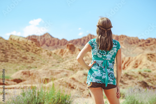 girl standing on the road with her back