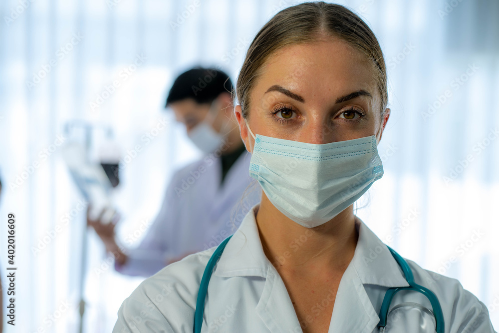 Caucasian medical doctor with patient infected from virus pandemic in hospital Caucasian medical doctor with patient infected from virus pandemic in hospital