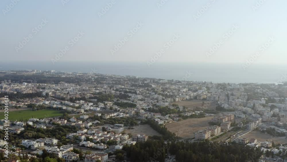 Aerial shot Paphos Cyprus. Drone flying over the center of the historic city x houses, skyscrapers in a landscape with a background of the sea. Aerial shot Paphos Cyprus. Drone flying over the center of the historic city x houses, skyscrapers in a landscape with a background of the sea.