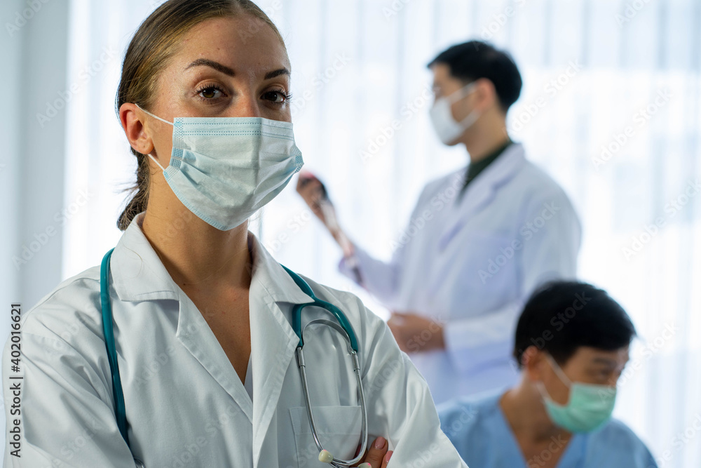 Caucasian medical doctor with patient infected from virus pandemic in hospital Caucasian medical doctor with patient infected from virus pandemic in hospital
