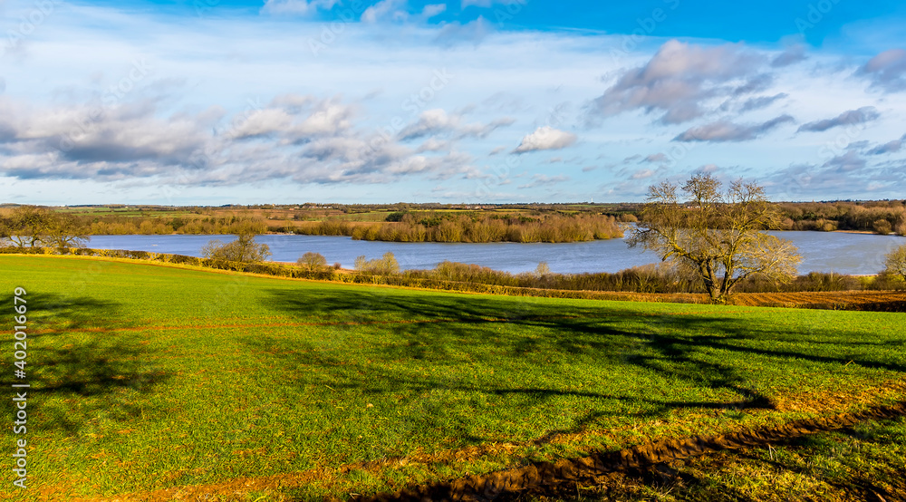 A view across the fields towards Pitsford Reservoir, UK on a sunny day