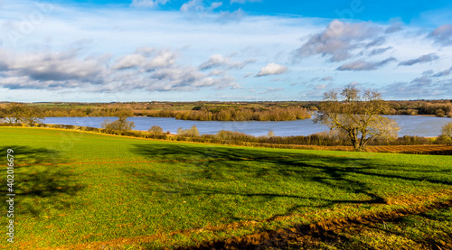 A view across the fields towards Pitsford Reservoir, UK on a sunny day photo