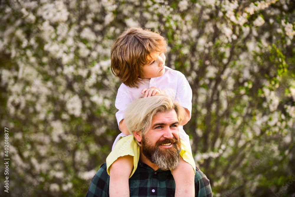 Happy family. Little boy and father in nature background. Springtime. Hipster piggybacking baby. Bearded brutal man good father. Dad and son. Best dad ever. Fathers day. Child having fun with dad Happy family. Little boy and father in nature background. Springtime. Hipster piggybacking baby. Bearded brutal man good father. Dad and son. Best dad ever. Fathers day. Child having fun with dad