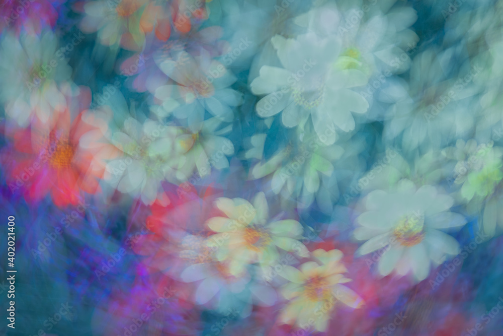 Variety of pastel flowers captured in multiexposures while the camera was rotated for each of the exposures. 