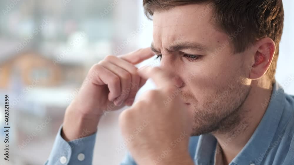 Young distraught man thinking of something at home. Waiting for inspiration. Young distraught man thinking of something at home. Waiting for inspiration.