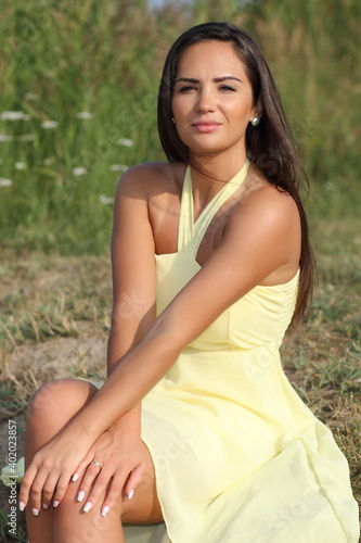 young beautiful woman in yellow dress