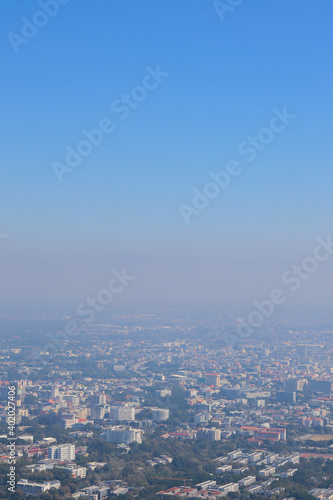 Blurred images of morning smog over Chiang Mai city, causing the problem of smog caused by forest fires and causing public health problems because of the small dust that comes with the haze . © thatinchan