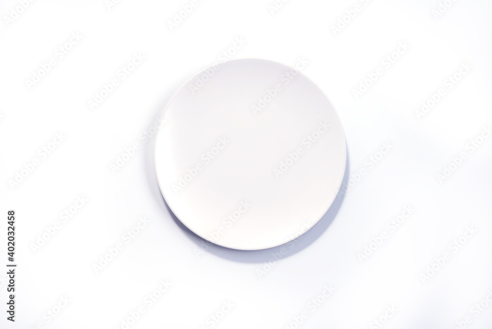 Empty Matte White plate isolated on white background top view Empty Matte White plate isolated on white background top view