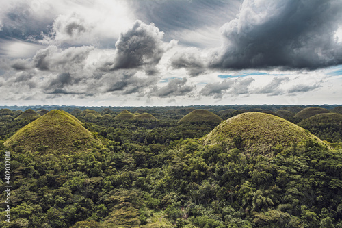 Chocolate Hills with a group of clouds in the sky