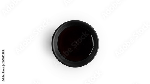 Soy sauce in a saucepan on a white background. High quality photo