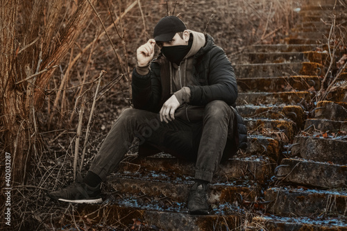 ganster sitting on the ground