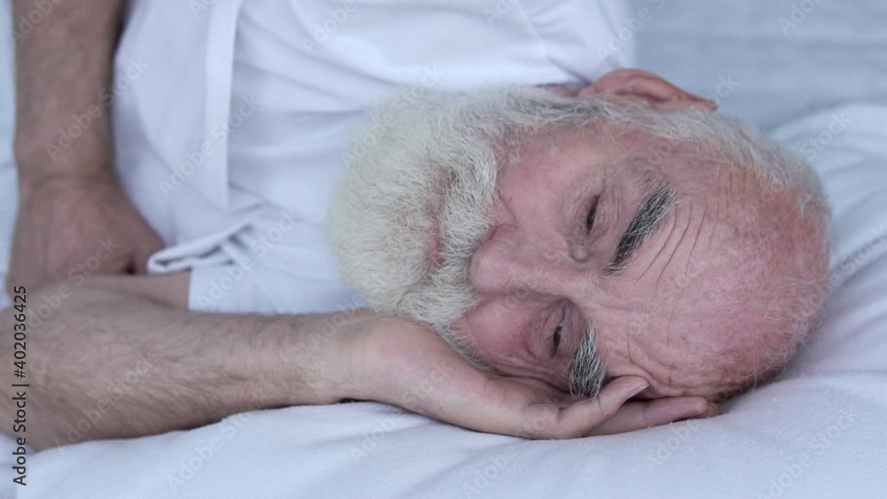 Retired male waking up in the morning, biological clock, health care, rest Retired male waking up in the morning, biological clock, health care, rest
