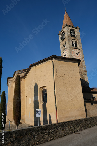 A vertical shot of a church in Comano Ticino in the South of Switzerland photo