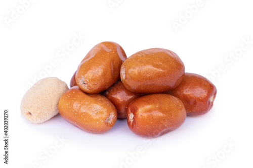 Dried, shelled and peeled silverberry fruit isolated on white background photo