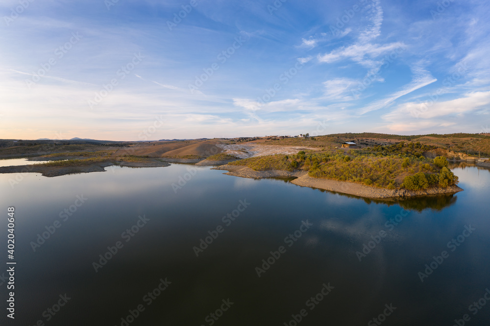 Drone aerial panorama of a dam lake reservoir at sunset in Terena, Portugal Drone aerial panorama of a dam lake reservoir at sunset in Terena, Portugal