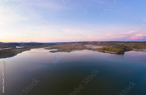 Drone aerial panorama of a dam lake reservoir at sunset in Terena  Portugal