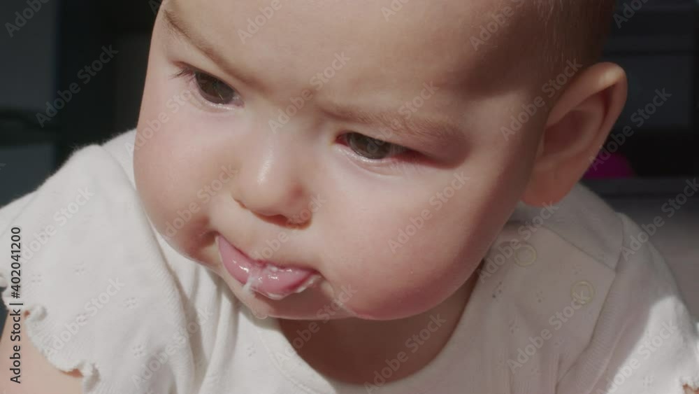 Close up of lovely little baby girl smile. Portrait of infant smile. Close up of lovely little baby girl smile. Portrait of infant smile.