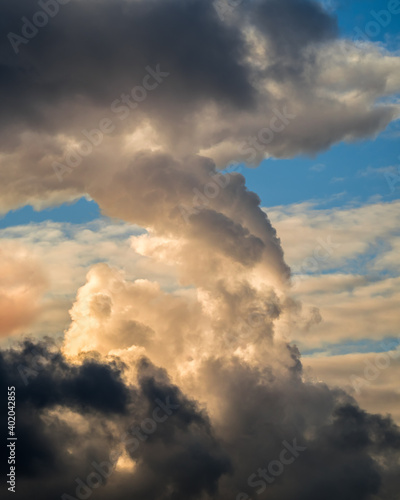 Bizarre dark cloud like mushroom in blue sky