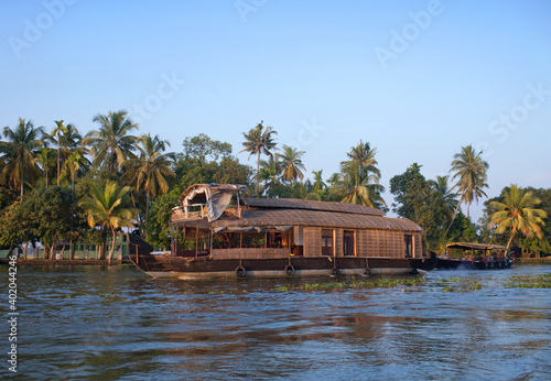 Indian houseboat floating in backwaters in Alleppey, Kerala state, South India photo