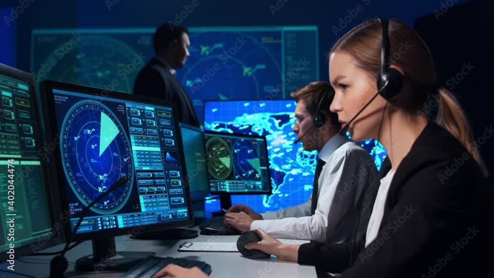 Workplace of the air traffic controllers in the control tower. Team of ...