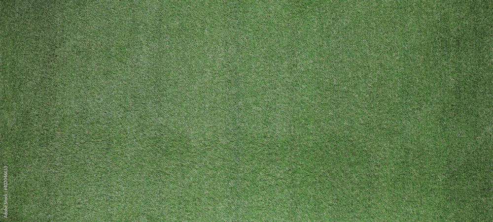 Fototapeta premium dark background of artificial green sports turf