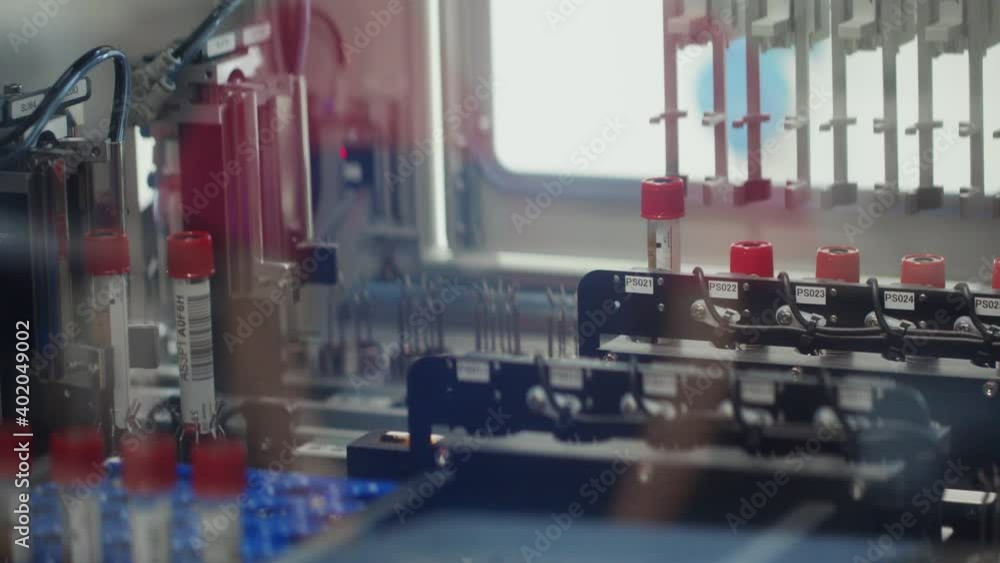 Medical laboratory equipment during treatment, automated device testing blood, serum, urine and plasma samples. Medical laboratory equipment during treatment, automated device testing blood, serum, urine and plasma samples.