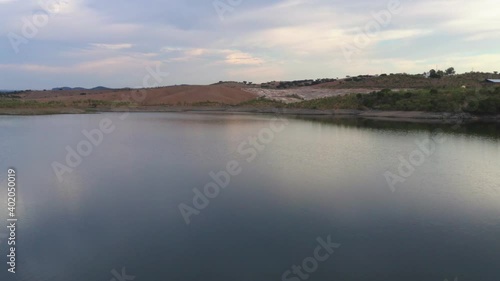 Drone aerial panorama of a desert like hill landscape with marble stones dust at sunset in Terena, Portugal photo